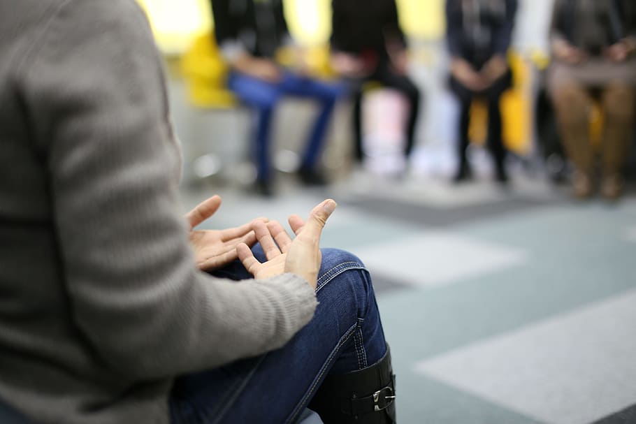 person participating in a group therapy session
